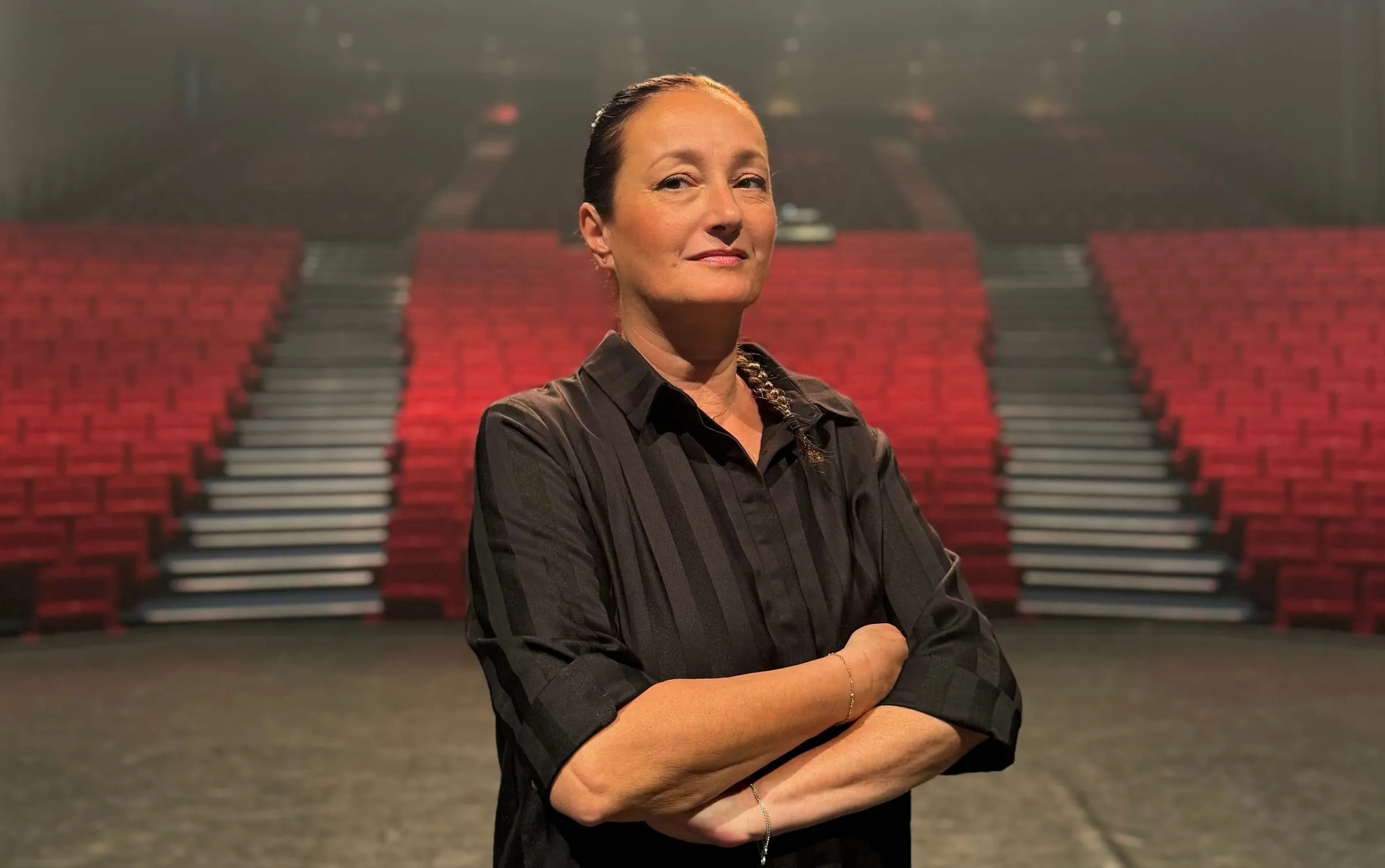 Alexandra Gérard on stage, in a theatre